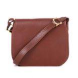 Cartier, a small Bordeaux flap handbag, crafted from smooth burgundy leather, with polished gold-