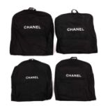 Chanel, four garment bags, crafted from back canvas with the maker's white branding to the front,