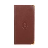 Cartier, a long Bordeaux Bifold wallet, crafted from smooth burgundy leather, featuring the maker'