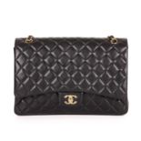 Chanel, a Maxi Classic Flap handbag, designed with a black diamond quilted leather exterior,