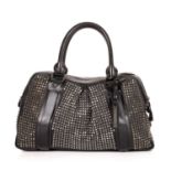 Burberry, a studded Knight holdall bag, crafted from black leather featuring a gunmetal studded