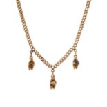 An early 20th century 15ct gold curb-link necklace, with bear charms