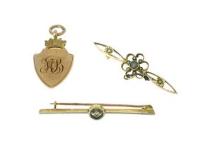 A 15 carat gold gem set bar brooch, open floral design with peridot and seed pearls, together with a