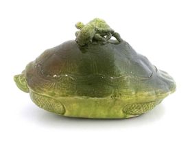 An art pottery turtle soup tureen, circa 1880, green faience glazed earthenware, modelled as a