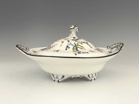 A Meissen Kakiemon tureen, twin handled relief moulded with shells, ogee lid and bracket feet,