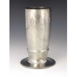 Liberty and Co., a Tudric Arts and Crafts pewter vase, model 01145, planished footed form, 19cm