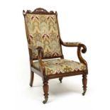 A William IV Rosewood library armchair, circa 1830, acanthus scroll pediment and finials to the