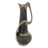 A Bretby Arts and Crafts metallic strap jug, globe and cone form with tendril strap handle, in the