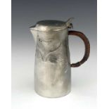 Archibald Knox for Liberty and Co., a Tudric Arts and Crafts pewter lidded jug, model 0278, cast