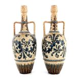 George Tinworth for Doulton Lambeth, a pair of stoneware vases, 1884, twin handled shouldered
