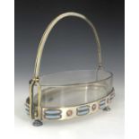 A Secessionist silver plate and enamelled basket, circa 1905, in the style of Josef Hoffmann and the