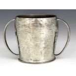 Archibald Knox for Liberty and Co., a Tudric Arts and Crafts pewter twin handled loving cup, model