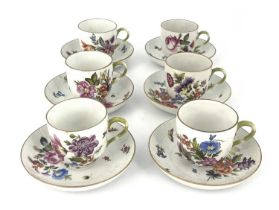 Herend, a part tea set, of six cups and saucers, circa 1911, relief moulded rattan ground, painted