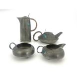 Archibald Knox for Liberty and Co., a Tudric Arts and Crafts pewter and enamelled four piece tea