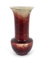 Ruskin Pottery, a High fired vase, 1922, sang de boeuf glaze, bulbous form with flared neck,