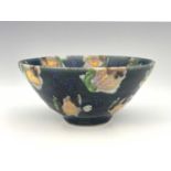 Clive Davies (British, 1939), a stoneware bowl, decorated with wax resist and various coloured