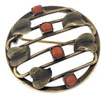 A Secessionist silver gilt and coral brooch, in the style of Josef Hoffmann, circular form with wire