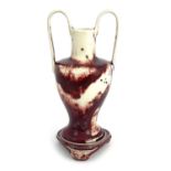 Ruskin Pottery, a High Fired twin handled vase and stand, 1932, high handled amphora form on Chinese