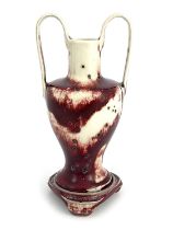 Ruskin Pottery, a High Fired twin handled vase and stand, 1932, high handled amphora form on Chinese