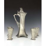 WMF, a Jugendstil silver plated claret jug with six beakers, waisted with five bracket feet,