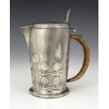 Archibald Knox for Liberty and Co., a Tudric Arts and Crafts pewter jug, model 0967, stylised bud