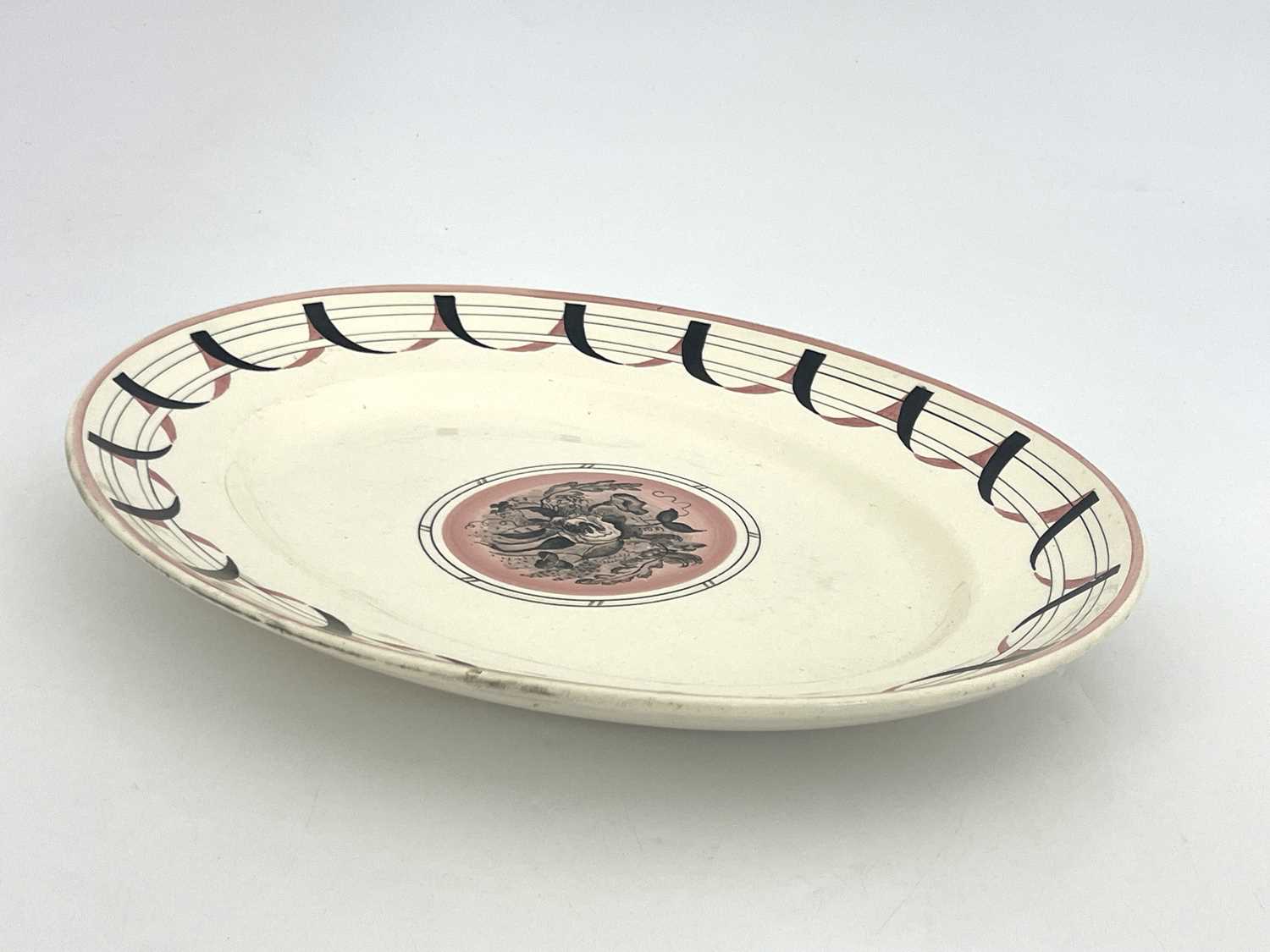 Graham Sutherland for Clarice Cliff, a Harrods Exhibition platter, 1934, oval form, painted with a - Image 2 of 3