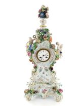 A Meissen bracket clock on stand, circa 1850, with floral encrused urn finial on reticulated domed