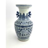 A 19th Century Chinese provincial blue and white baluster vase, two-dimensional beast handles, the