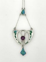 Charles Horner, an Arts and Crafts silver and enamelled pendant, Chester 1908, open shield form with