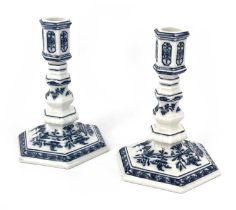 A pair of Meissen Onion pattern candlesticks, of 18th century taper stick form, octagonal knopped