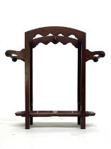 A 19th century mahogany stick stand, turned side handles and two metal drip trays, 71cm high