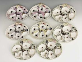 Union Porcelain Works (UPW), a set of eight oval oyster plates, moulded with oyster and other shells