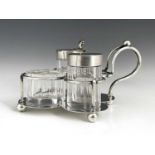 Christopher Dresser for Hukin and Heath, an Arts and Crafts silver and glass three piece cruet and