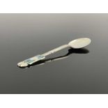 Archibald Knox for Liberty and Co., an Arts and Crafts silver and enamelled Medea teaspoon,