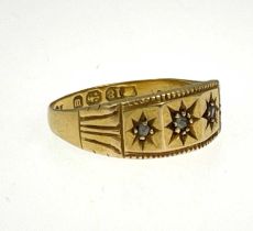 A late Victorian 18ct gold diamond three-stone ring