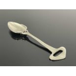 Liberty and Co., a Tudric Arts and Crafts pewter preserve spoon, the pointed bowl on a multi tendril
