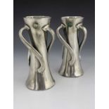 Liberty and Co., a pair of Tudric Arts and Crafts pewter and cabochon set vases, model 030,