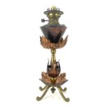 W A S Benson, an Arts and Crafts copper and brass oil lamp, circa 1900, the turned baluster stem
