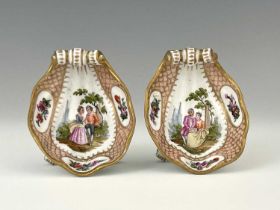A pair of 19th Century Meissen style shell-shaped condiments, painted Watteau style scenes of