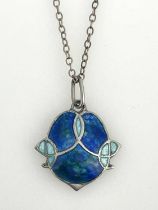 James Fenton, an Arts and Crafts silver and enamelled pendant, shield form with blue enamel