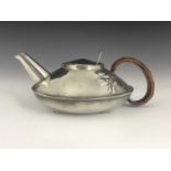 Archibald Knox for Liberty and Co., a Tudric Arts and Crafts pewter teapot, model 023, squat ovoid