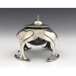 An Arts and Crafts silver inkwell, Mappin and Webb, London 1904, the spherical ink pot within a four