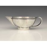 Edward Spencer for Artificers Guild, an Arts and Crafts silver sauce boat, London 1932, planished