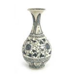 A Chinese blue and white vase, baluster form, painted with pomegranates in foliate scroll ground,