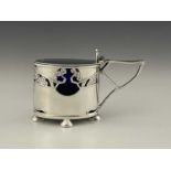 Kate Harris for Goldsmiths and Silversmiths Company, an Arts and Crafts silver mustard pot, London