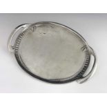 Archibald Knox for Liberty and Co., a Tudric Arts and Crafts pewter twin handled tray, model 0311,