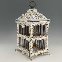 A French faience birdcage, Moustiers, circa 1790, square form with reticulated pagoda top, fitted