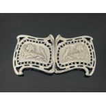 An Arts and Crafts silver buckle, William Comyns, London 1901, each scroll cartouche panel cast with