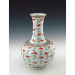 A 20th century Chinese baluster vase, extended neck, ovoid body, the whole decorated with iron red