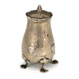 Oliver Baker for Liberty and Co., an Arts and Crafts silver pepper pot, Birmingham 1902, planished